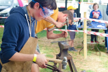 Boy Blacksmithing